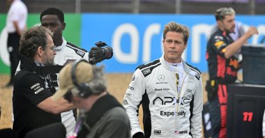 Actor Brad Pitt (R) is pictured at the British Grand Prix during the filming of an F1-inspired movie, Silverstone, U.K., July 9, 2023. (Reuters Photo)