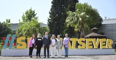 Youth and Sports Minister Osman Aşkın Bak poses for a souvenir photo with the youth, Istanbul, Türkiye, July 10, 2023. (AA Photo)