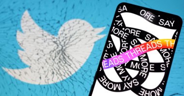 Meta Threads app logo is placed on cracked Twitter app logo in this illustration from July 7, 2023. (Reuters Photo)