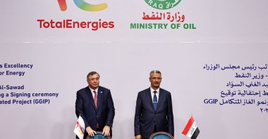 Iraqi Deputy Prime Minister for Energy Affairs and Minister of Oil, Hayan Abdul Ghani Al-Swad (R) and Patrick Pouyanne, Chair and CEO of TotalEnergies, attend a signing ceremony of the Gas Growth Integrated Project (GGIP) in Baghdad, Iraq, July 10, 2023. (Reuters Photo)