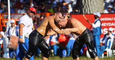 Ismail Balaban (L) in action with Yusuf Can Zeybek during the 662nd Historical Kırkpınar Oil Wrestling, Edirne, Türkiye, July 9, 2023. (AA Photo)