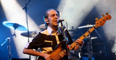 Özkan Uğur plays the guitar during an MFÖ concert at Cemil Topuzlu Open-Air Theater, in Istanbul, Türkiye, June 25, 2015. (AA Photo)