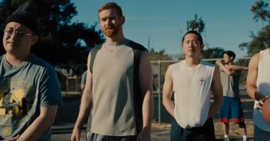 Steven Yeun (C-R) among other actors, in a scene from the TV series "Beef." (Screenshot from Netflix)