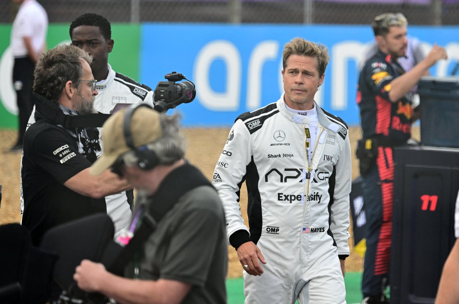 Actor Brad Pitt (R) is pictured at the British Grand Prix during the filming of an F1-inspired movie, Silverstone, U.K., July 9, 2023. (Reuters Photo)