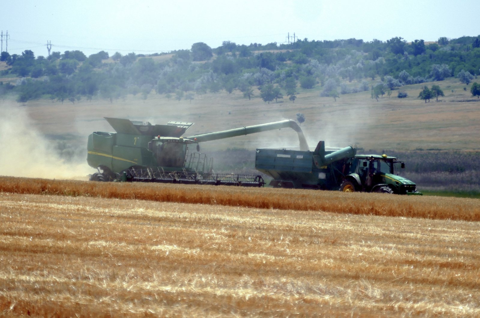 Ukrainian farmers harvest grain in the Odessa region amid the Russian invasion, south Ukraine, June 23, 2023. (EPA Photo)
