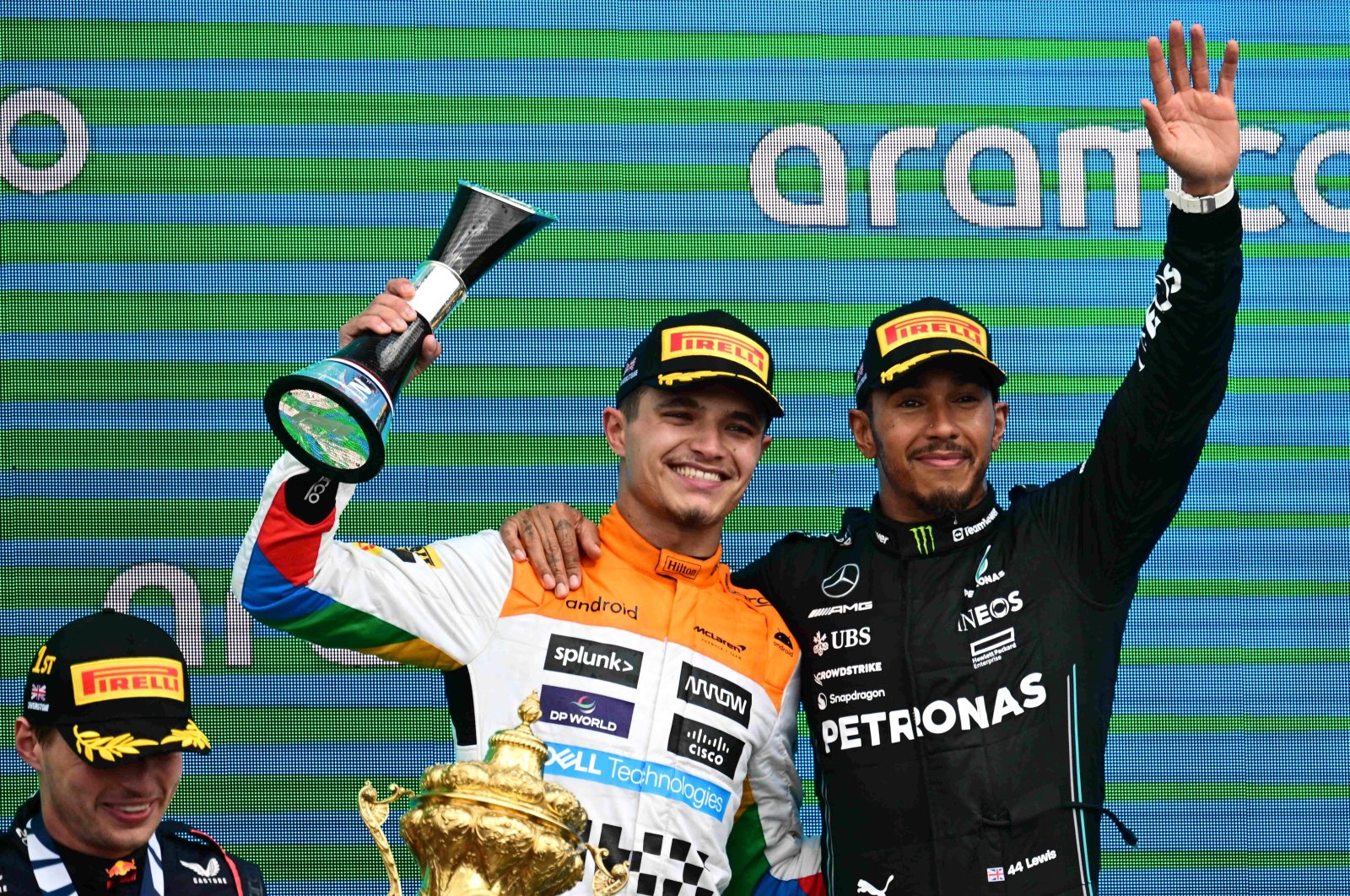 Second placed British Formula One driver Lando Norris (C) of McLaren F1 Team, first placed Dutch Formula One driver Max Verstappen (L) of Red Bull Racing and third placed British Formula One driver Lewis Hamilton (R) of Mercedes-AMG Petronas celebrate on the podium for the Formula 1 British Grand Prix 2023, at the Silverstone Circuit race track, Silverstone, UK., July 9, 2023. (EPA Photo)