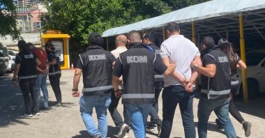 Police officers escort captured suspects in an operation against FETÖ, in Tunceli, eastern Türkiye, June 21, 2023. (AA Photo) 