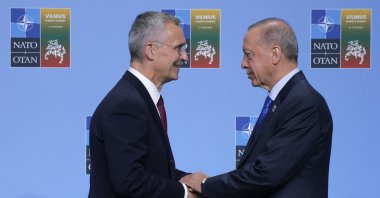 NATO Secretary-General Jens Stoltenberg (L) shakes hands with President Recep Tayyip Erdoğan as he arrives for the NATO summit in Vilnius, Lithuania, July 11, 2023. (AFP Photo)