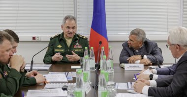 Russian Defense Minister General of the Army Sergei Shoigu (C-L) speaking during a meeting upon his visit to inspect the implementation of the state defense orders at enterprises in the Republic of Tatarstan, Russia, July 11, 2023. (Russian Defense Ministry press service handout via EPA)