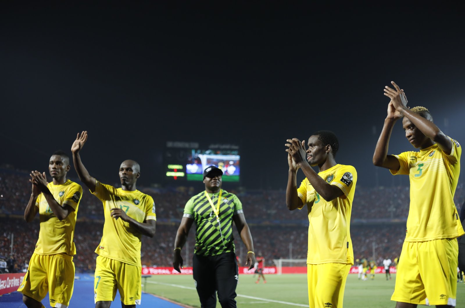 Zimbabwe national team players applaud their fans after the group A football match against Uganda at the Africa Cup of Nations at Cairo International Stadium in Cairo, Egypt, June 26, 2019. (AP Photo)