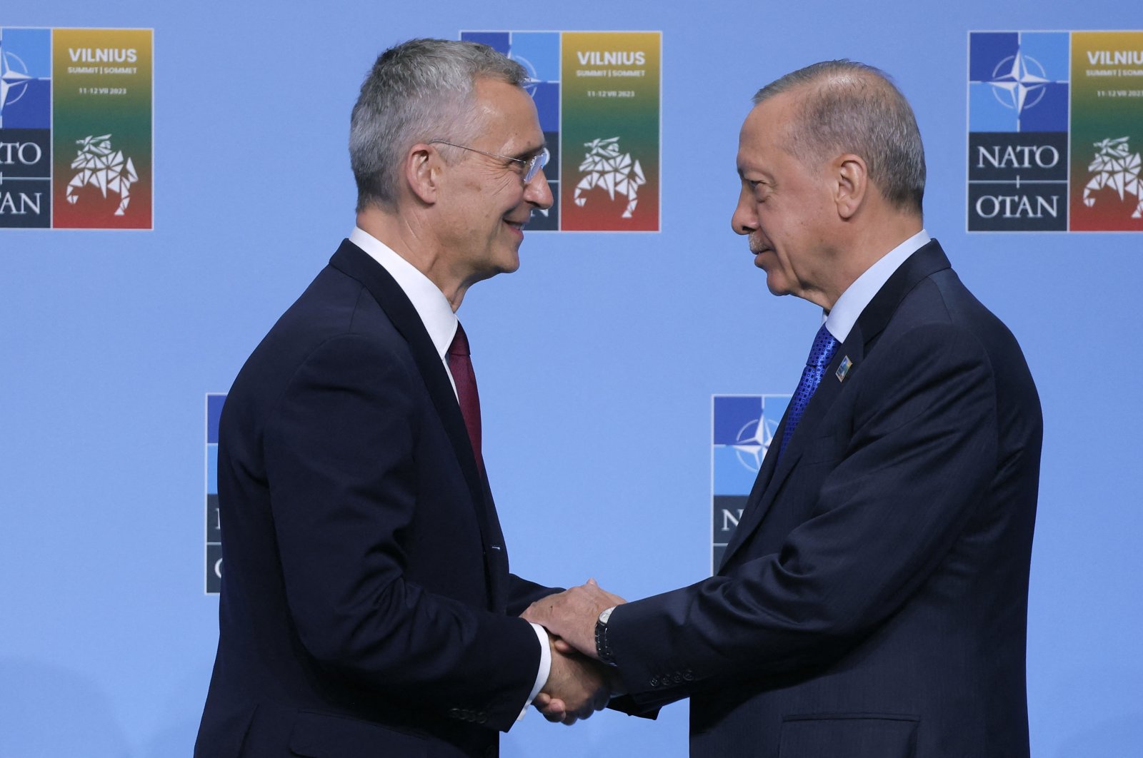 NATO Secretary-General Jens Stoltenberg (L) shakes hands with President Recep Tayyip Erdoğan as he arrives for the NATO summit in Vilnius, Lithuania, July 11, 2023. (AFP Photo)