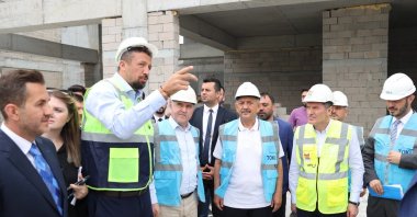 Turkish Basketball Federation President Hidayet Türkoğlu (2nd L) addresses Youth and Sport Minister Osman Aşkın Bak (C) at the construction of Abdi Ipekçi Sports Hall, Istanbul, Türkiye, July 10, 2023. (IHA Photo)
