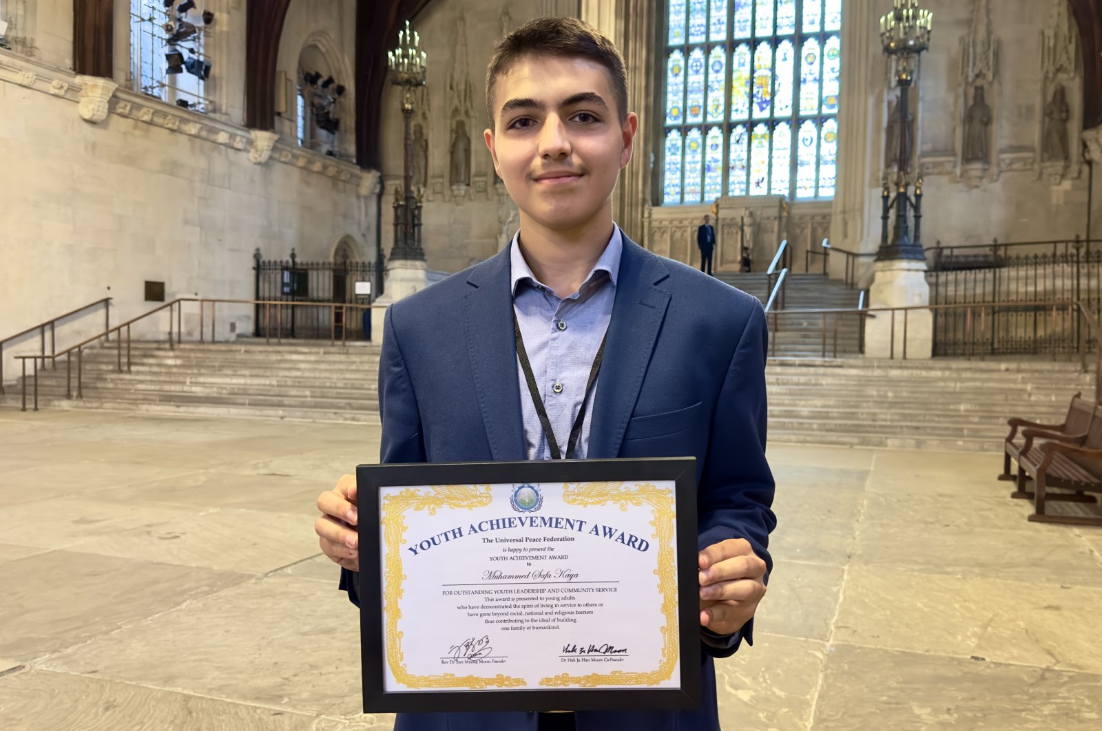 Sixteen-year-old Muhammed Safa Kaya poses with his award presented by the U.N.&#039;s Universal Peace Federation (UPF) for outstanding leadership performance, Watford, U.K., July 12, 2023. (AA Photo)