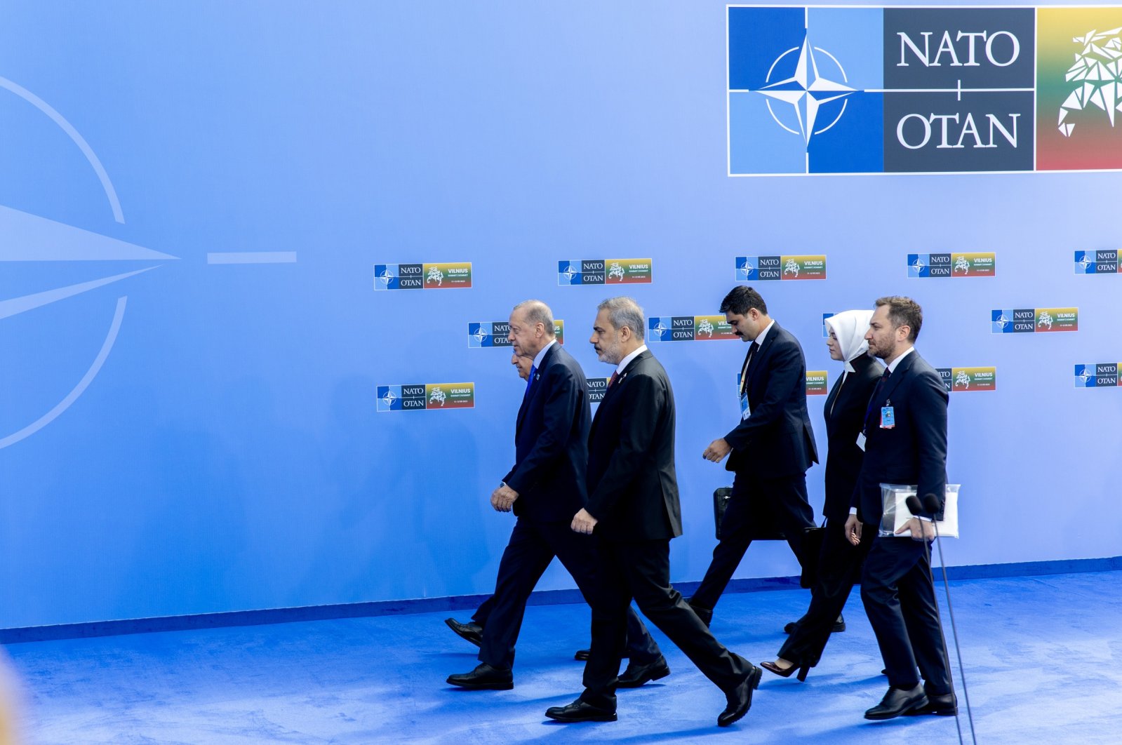 President Recep Tayyip Erdoğan (L) walks to join the official group photo at the NATO summit in Vilnius, Lithuania, July 11, 2023. (AA Photo)