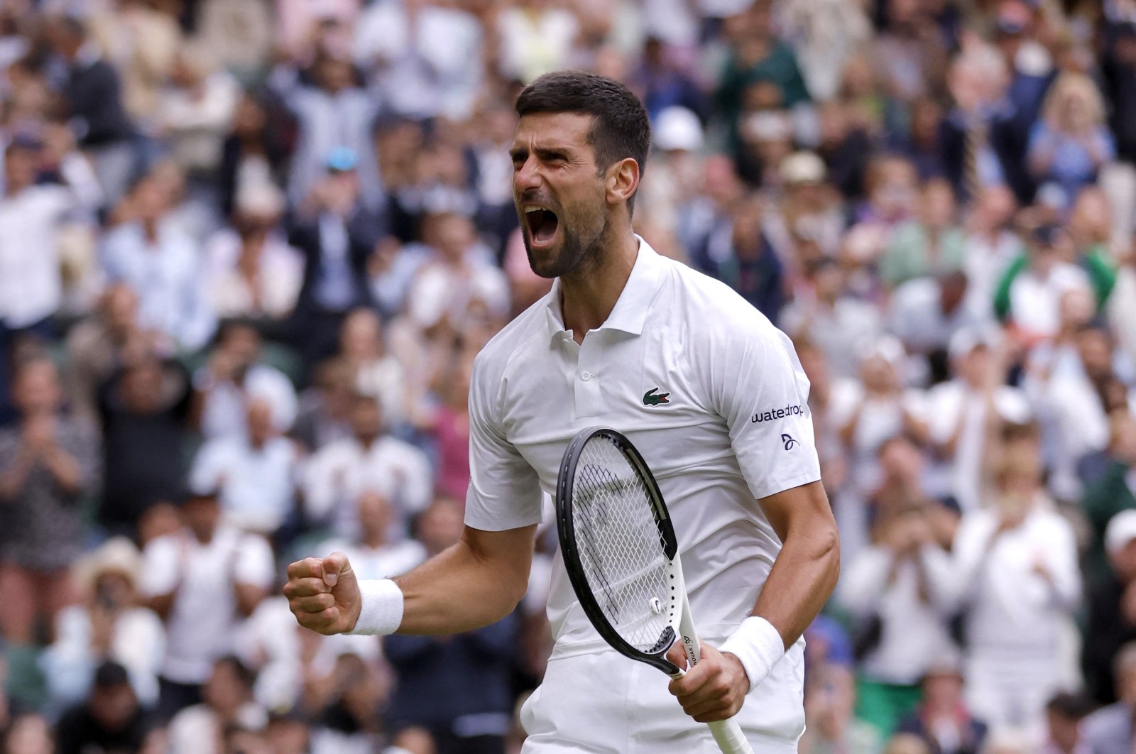 Serbia&#039;s Novak Djokovic celebrates winning his quarterfinal match against Russia&#039;s Andrey Rublev at the All England Lawn Tennis and Croquet Club, London, UK., July 11, 2023. (Reuters Photo) 
