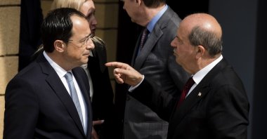 Greek Cypriot President Nikos Christodoulides (L) and Turkish Cypriot President Ersin Tatar (R) speak after a meeting at the residence of the U.N. peacekeeping force's chief of mission inside the U.N.-controlled buffer zone in Lefkoşa (Nicosia), TRNC, Feb. 23, 2023. (Reuters Photo)