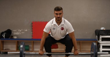 Young Turkish weightlifter Sami Baki Kıymet showcases his skills during training at the Seljuk Belediyespor Club, Konya, Türkiye, July 12, 2023. (AA Photo)