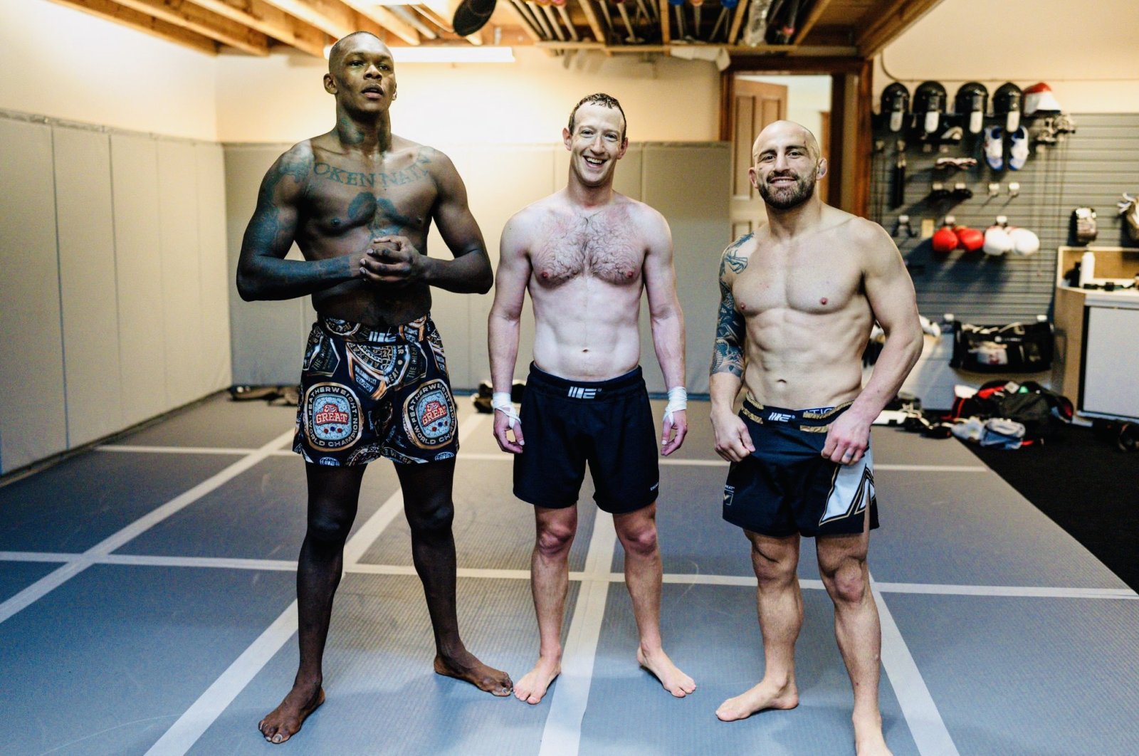 Mark Zuckerberg (C) poses with Israel Adesanya (L) and Alexander Volkanovski after training for the UFC in this undated photo. (Zuck on Instagram)