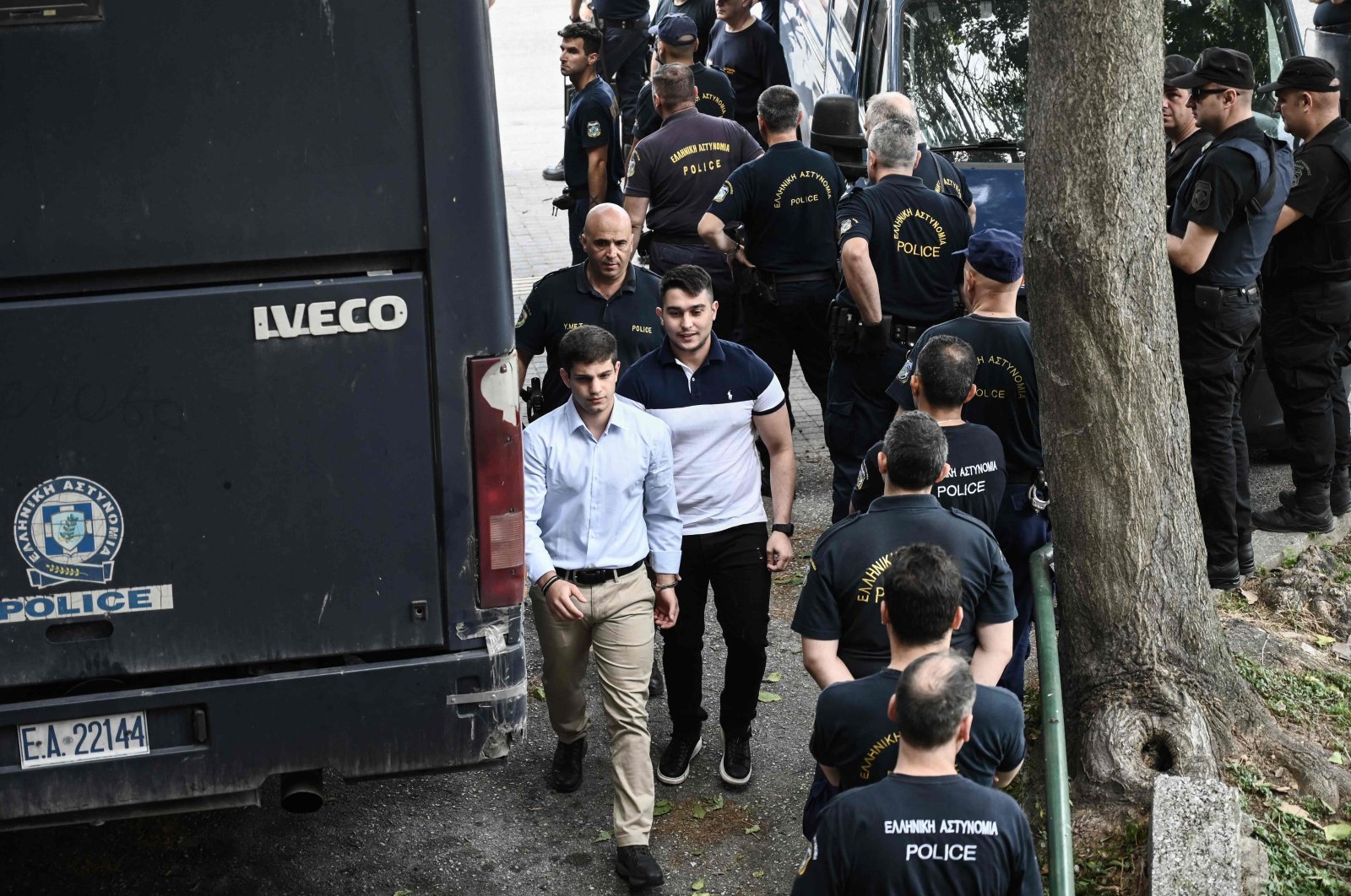 Individuals convicted for the murder of the late football fan Alkis Kampanos, who was killed by young hooligans, arrive at the courthouse, Thessaloniki, Greece, July 12, 2023. (AFP Photo)