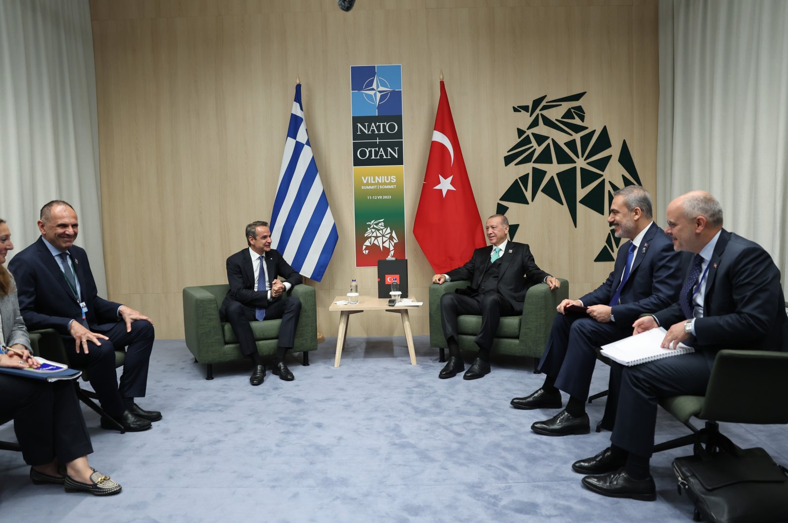 President Recep Tayyip Erdoğan (center R) and Greek Prime Minister Kyriakos Mitsotakis (center L) hold talks in Vilnius, Lithuania, July 12, 2023. (AA Photo)
