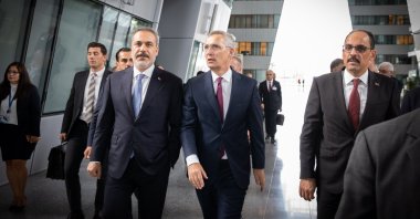 Türkiye’s Foreign Minister Hakan Fidan (L) and NATO Secretary-General Jens Stoltenberg (C) are seen before a trilateral meeting between Türkiye, Sweden and Finland at the NATO headquarters in Brussels, Belgium, July 6, 2023. (AA Photo)