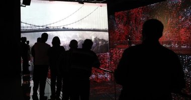 Visitors of the museum look at a display of Istanbul's July 15 Martyrs' Bridge, Ankara, Türkiye, July 17, 2021. (AA Photo)