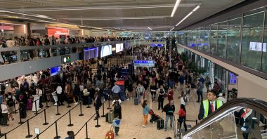 Travelers wait at the departure area as airport employees stage a strike causing flight delays and cancellations at the Geneva Airport, Geneva, Switzerland, June 30, 2023. (Reuters Photo)