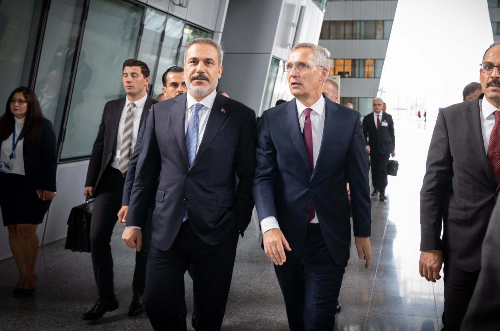 Türkiye’s Foreign Minister Hakan Fidan (L) and NATO Secretary-General Jens Stoltenberg (C) are seen before a trilateral meeting between Türkiye, Sweden and Finland at the NATO headquarters in Brussels, Belgium, July 6, 2023. (AA Photo)