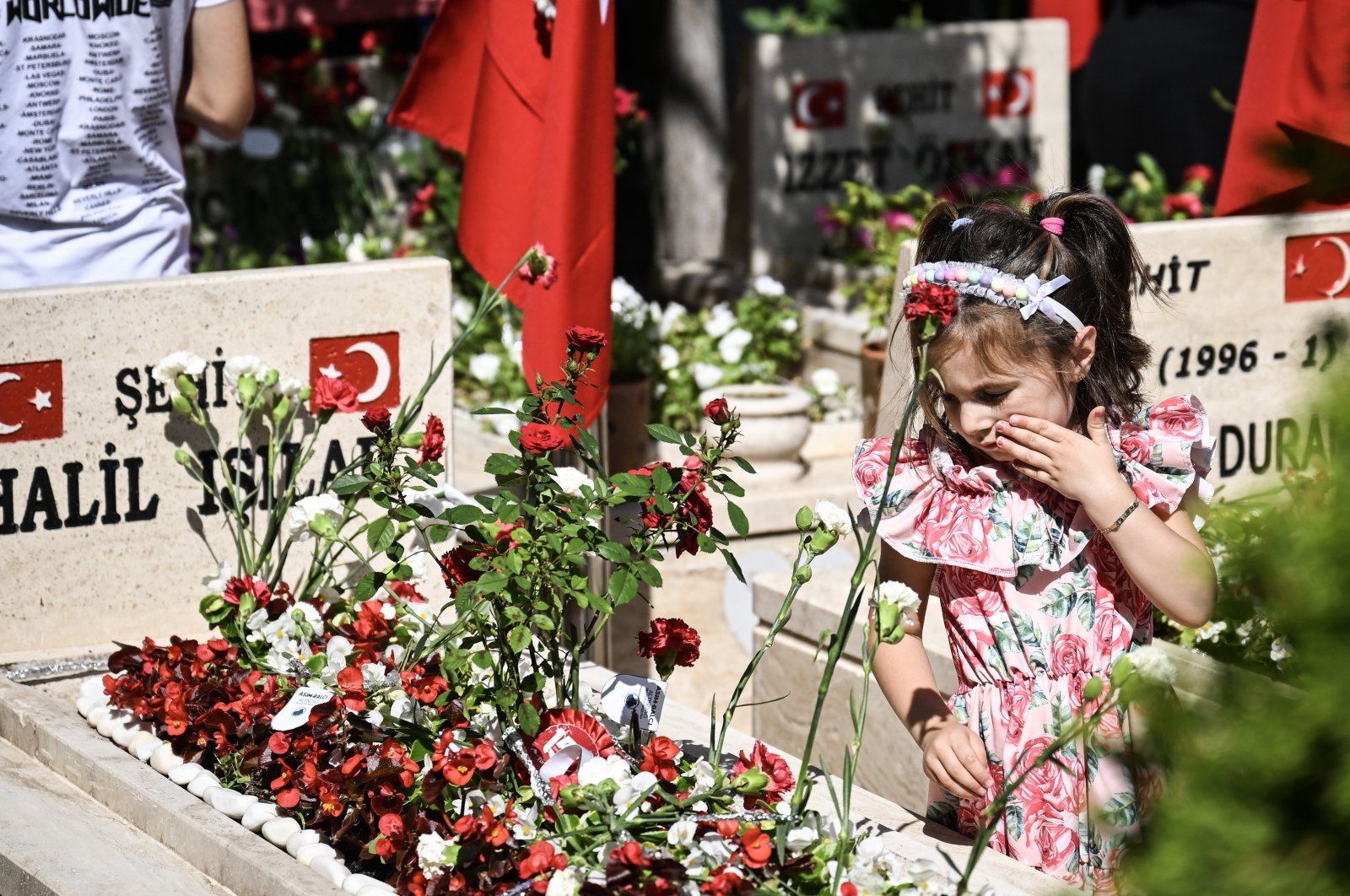 Family, friends mark July 15 Democracy and National Unity Day as they visit graves of soldiers who lost their lives in action in Mersin, Türkiye, July 15, 2023. (AA Photo)