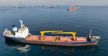 The cargo ship Mehmet Bey waits to pass through the Bosporus off the shores of Yenikapı during a misty morning in Istanbul, Türkiye, Oct. 31, 2022. (Reuters Photo)