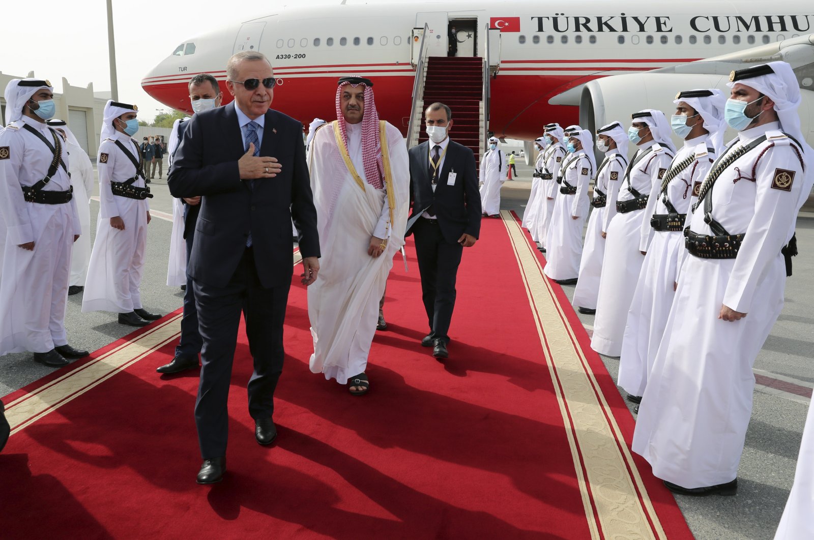 President Recep Tayyip Erdoğan inspects the Qatari honor guard at Doha Airport before a meeting with Emir of Qatar Sheikh Tamim bin Hamad Al Thani, Doha, Qatar, July 2, 2020. (AP Photo)