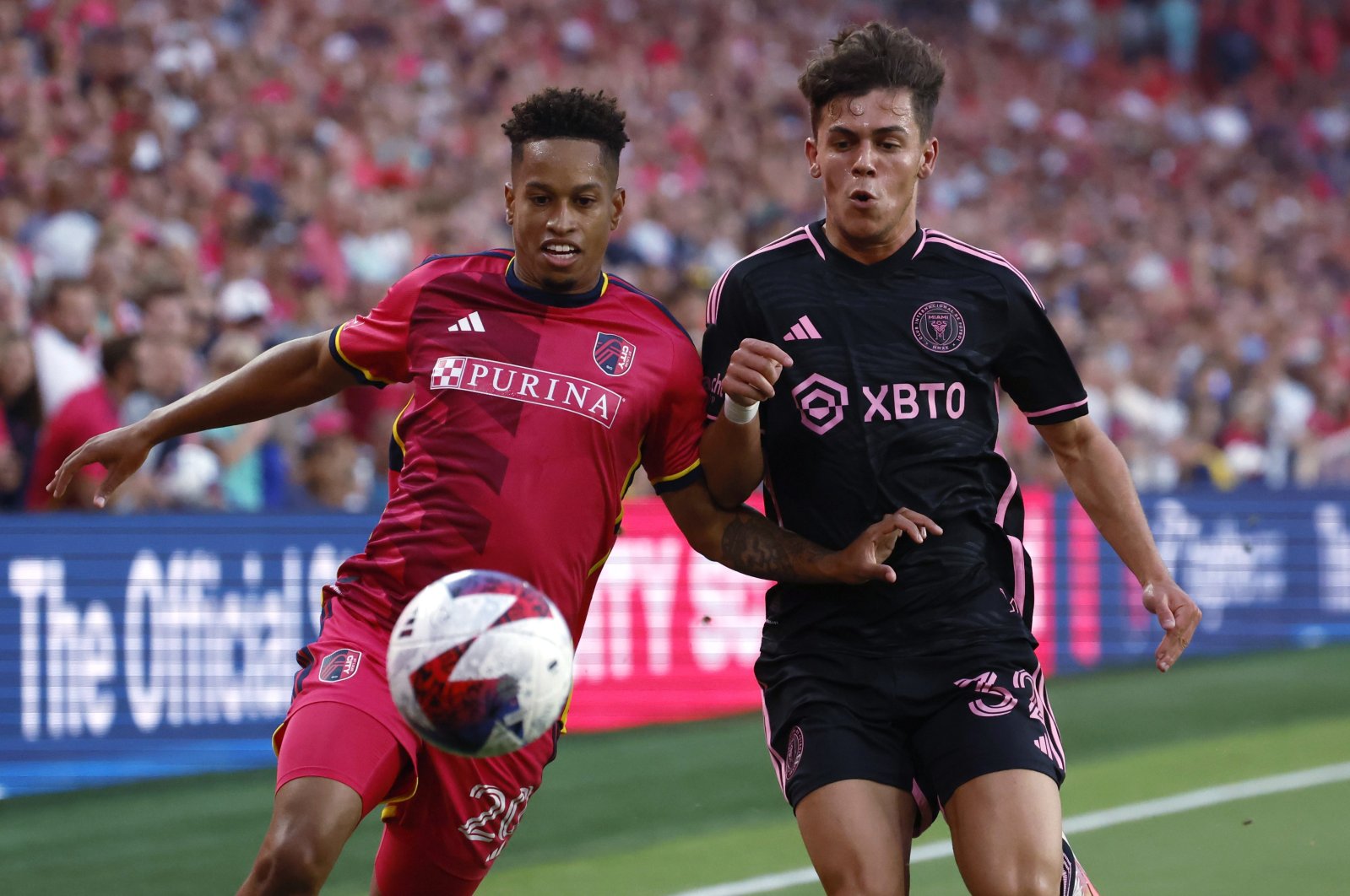 St. Louis City defender Akil Watts (L) and Inter Miami defender Noah Allen vie for the ball during an MLS match, St. Louis, U.S., July 15, 2023. (AP Photo)