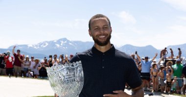 Stephen Curry of the NBA Golden State Warriors holds his trophy after winning the championship on Day Three of the 2023 American Century Championship at Edgewood Tahoe Golf Course, Stateline, Nevada, U.S., July 16, 2023. (AFP Photo)