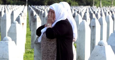 A Bosnian Muslim woman weeps during a funeral ceremony for 30 newly identified Muslim Bosnian victims, at the Potocari Memorial Center and Cemetery, in Srebrenica, Bosnia-Herzegovina, July 11, 2023. (EPA Photo)