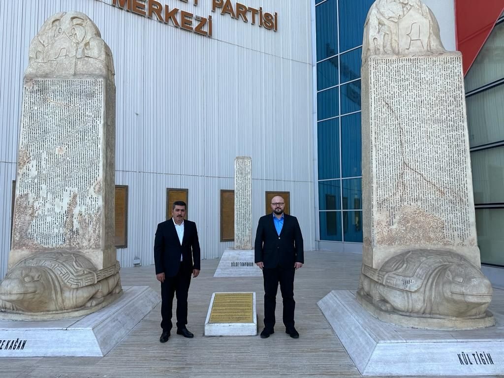Fehim Ertuğrul Isa (L) and Dr. Cemil Doğaç Ipek pose outside MHP headquarters in the capital Ankara, Türkiye, July 18, 2023. (Courtesy of the MHP)