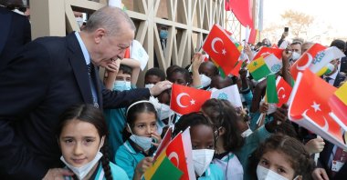 President Recep Tayyip Erdoğan greets children during the inauguration ceremony of an official building of Türkiye's Dakar Embassy, in Dakar, Senegal, Feb. 2, 2022. (AA Photo)