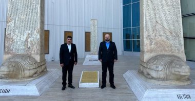 Fehim Ertuğrul Isa (L) and Dr. Cemil Doğaç Ipek pose outside MHP headquarters in the capital Ankara, Türkiye, July 18, 2023. (Courtesy of the MHP)