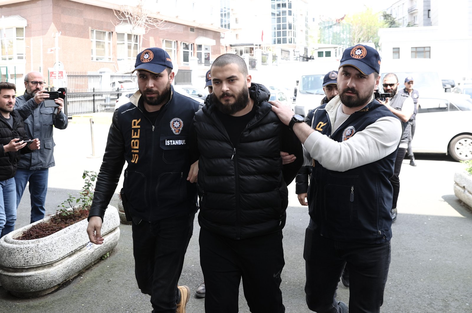 Faruk Fatih Özer, the founder and CEO of the collapsed crypto exchange Thodex, is being brought to Istanbul Police Department, in Istanbul, Türkiye, April 20, 2023. (AA Photo)