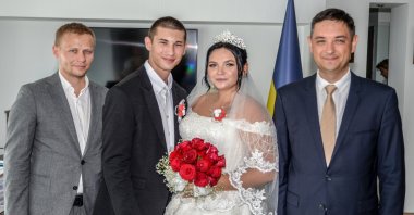 Artur Borysov and Diana Hliebova, both orphans from war-torn Ukraine, pose during their wedding in the Consulate General of Ukraine, Antalya, Türkiye, July 19, 2023. (AA Photo)