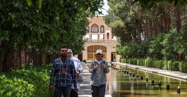 A guide leads tourists at the Dowlat Abad Garden in Iran&#039;s central city of Yazd, Iran, July 3, 2023. (AFP Photo)