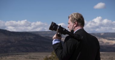 This image released by Universal Pictures shows filmmaker Christopher Nolan on the set of &quot;Oppenheimer.&quot; (AP Photo)