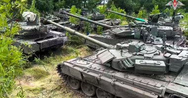 Tanks belonging to Russia's Wagner military contractor are parked ahead of their handover to the Russian military at an undisclosed location, July 12, 2023. (AP Photo)