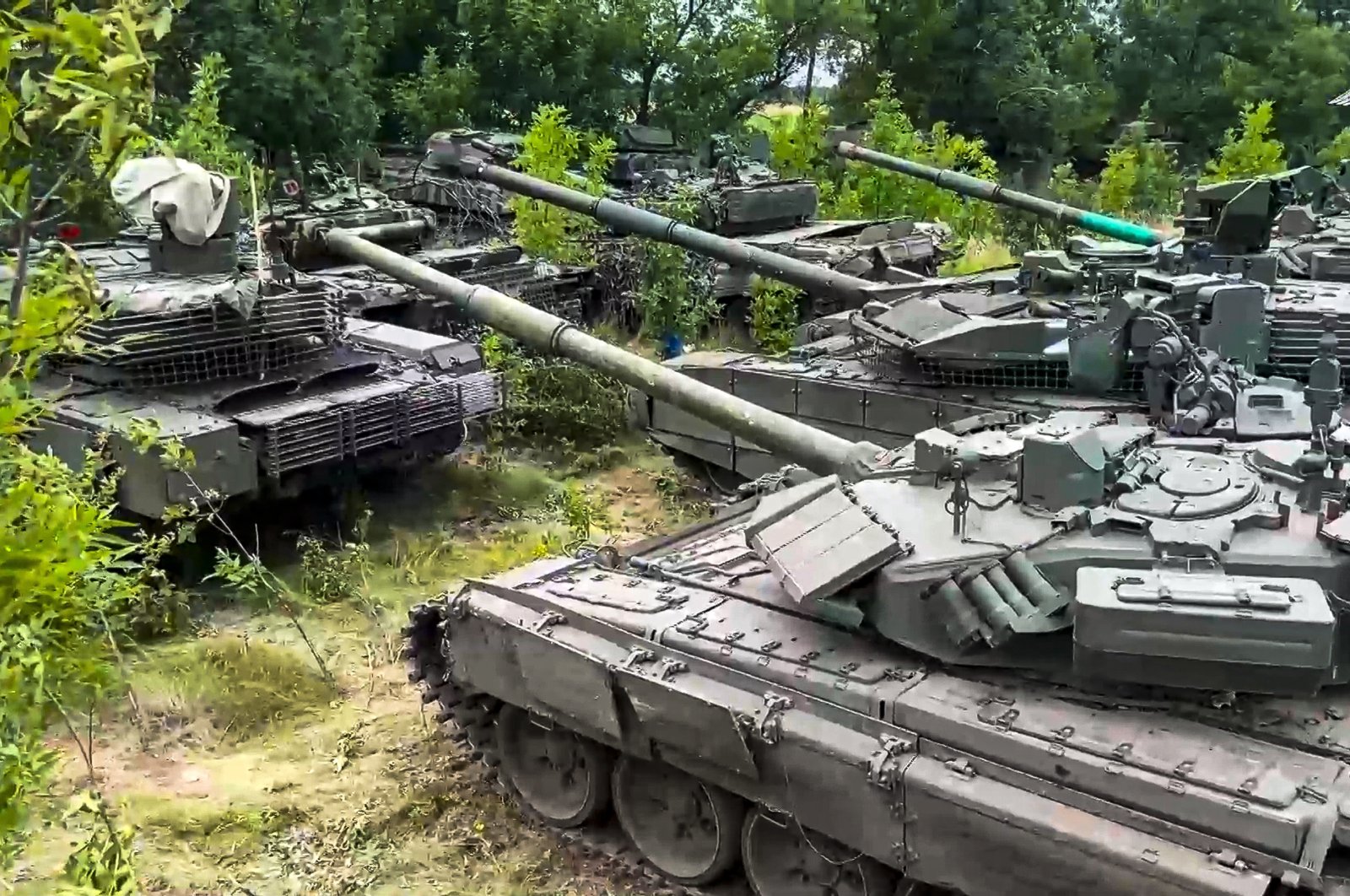 Tanks belonging to Russia&#039;s Wagner military contractor are parked ahead of their handover to the Russian military at an undisclosed location, July 12, 2023. (AP Photo)