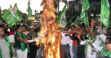 Jharkhand Mukhti Morcha (JMM) supporters burn an effigy during a protest over two women being allegedly raped and paraded naked in Manipur, at Albert Ekka Chowk, Ranchi, India, July 20, 2023. (Reuters Photo)