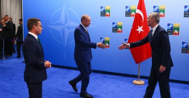 President Recep Tayyip Erdoğan (L) and NATO Secretary-General Jens Stoltenberg (R) shake hands next to Swedish Prime Minister Ulf Kristersson, in Vilnius, Lithuania, July 10, 2023. (AFP Photo)