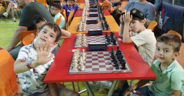 Young Turkish chess players pose for a photo at the 4th Chess Tournament hosted by KidZania, Istanbul, Türkiye, July 21, 2023. (IHA Photo)