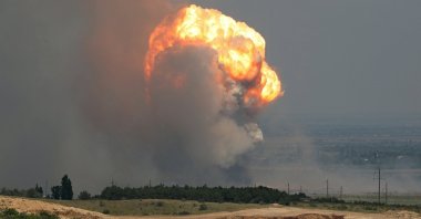 Smoke and flames rise from an explosion during a fire at a military training ground in the Kirovske district, Crimea, July 19, 2023. (Reuters Photo)