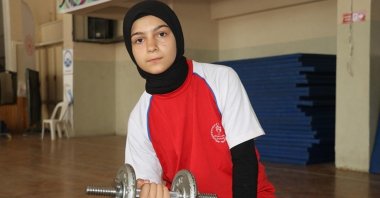 Turkish arm wrestling champion Şüheda Hançer poses for a photo during training at the Şehit Recep Ince Imam Hatip Middle School, Amasya, Türkiye, July 23, 2023. (AA Photo)