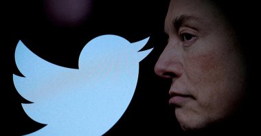 FILE PHOTO: Twitter logo and a photo of Elon Musk are displayed through a magnifier in this illustration taken Oct. 27, 2022. (Reuters Photo)