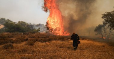 A firefighter near a raging wildfire in Vlichada near Athens, Greece, July 19, 2023. (AA Photo)